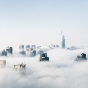 skyscrapers above clouds